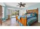 Spacious main bedroom with sliding glass doors to the patio, and a ceiling fan at 2516 Dixon Ter, Port Charlotte, FL 33981