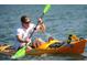 Personal paddles a yellow kayak in the ocean at 3862 59Th W Ave, Bradenton, FL 34210