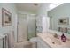 Bathroom with shower/tub combo, vanity, and linen storage at 139 Jose Gaspar Dr # 139, Englewood, FL 34223