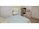 Bright bedroom with dresser, large closet, and access to patio at 139 Jose Gaspar Dr # 139, Englewood, FL 34223