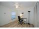Bright bedroom with wood-look floors and built-in closet at 139 Jose Gaspar Dr # 139, Englewood, FL 34223