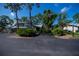 Exterior view of the property, showcasing landscaping at 139 Jose Gaspar Dr # 139, Englewood, FL 34223