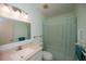 Clean bathroom with shower/tub combo, vanity with countertop sink, and grab bars at 139 Jose Gaspar Dr # 139, Englewood, FL 34223