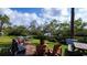 Relaxing fire pit area with seating and picnic tables at 139 Jose Gaspar Dr # 139, Englewood, FL 34223