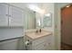 Clean bathroom with single vanity, shower and storage at 139 Jose Gaspar Dr # 139, Englewood, FL 34223