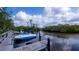 Community boat docks with several boats and a beautiful waterfront view at 139 Jose Gaspar Dr # 139, Englewood, FL 34223