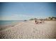 Relaxing beach scene with people enjoying the sun and sand at 139 Jose Gaspar Dr # 139, Englewood, FL 34223