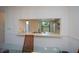 Kitchen features a breakfast bar and a view into the dining area at 139 Jose Gaspar Dr # 139, Englewood, FL 34223