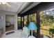Screened patio with view into bedroom and backyard at 139 Jose Gaspar Dr # 139, Englewood, FL 34223
