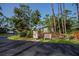 Landscaped community entrance with mailboxes and a bench at 139 Jose Gaspar Dr # 139, Englewood, FL 34223