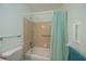 Bathroom with shower/tub, grab bars, and updated fixtures at 139 Jose Gaspar Dr # 139, Englewood, FL 34223