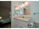 Neat bathroom with vanity, countertop sink, and mirrored medicine cabinet at 139 Jose Gaspar Dr # 139, Englewood, FL 34223