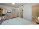 Comfortable bedroom with built-in dresser and access to bathroom and screened patio at 139 Jose Gaspar Dr # 139, Englewood, FL 34223