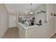 Stylish kitchen with updated stainless steel appliances and white cabinets at 6551 Hamlet Dr # 22A, Englewood, FL 34224