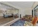 Bright screened porch with view of living room and backyard at 6551 Hamlet Dr # 22A, Englewood, FL 34224