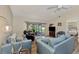 Living room with access to screened porch and view of backyard at 6551 Hamlet Dr # 22A, Englewood, FL 34224
