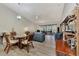 Open dining area with view to living room and screened porch at 6551 Hamlet Dr # 22A, Englewood, FL 34224