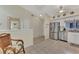 Eat-in kitchen showcasing stainless steel appliances and white cabinetry at 6551 Hamlet Dr # 22A, Englewood, FL 34224
