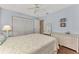 Bedroom with a queen-size bed and plenty of closet space at 6551 Hamlet Dr # 22A, Englewood, FL 34224