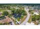 Aerial view of canal-front property with private docks and surrounding neighborhood at 6551 Hamlet Dr # 22A, Englewood, FL 34224
