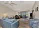 Relaxing living room with comfortable seating and access to a patio at 6551 Hamlet Dr # 22A, Englewood, FL 34224