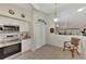 Bright kitchen with stainless steel appliances and white cabinets at 6551 Hamlet Dr # 22A, Englewood, FL 34224