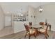 Cozy dining area with glass-top table and wicker chairs at 6551 Hamlet Dr # 22A, Englewood, FL 34224