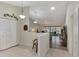 Well-lit kitchen offering stainless steel appliances and ample counter space at 6551 Hamlet Dr # 22A, Englewood, FL 34224
