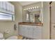 Bathroom with granite vanity, large mirror, and shower at 6551 Hamlet Dr # 22A, Englewood, FL 34224