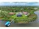 Waterfront property showcasing a house with pool and dock; wide view at 16147 Lankford Ct, Port Charlotte, FL 33981