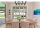 Dining room with sliding glass doors leading to a pool and patio area at 16147 Lankford Ct, Port Charlotte, FL 33981