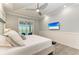 Main bedroom with mounted TV and access to private patio at 16147 Lankford Ct, Port Charlotte, FL 33981