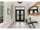 Bright and airy entryway with double doors and hardwood floors at 16147 Lankford Ct, Port Charlotte, FL 33981