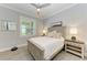 Bright bedroom with a ceiling fan, wood-like flooring, and a neutral color palette at 16147 Lankford Ct, Port Charlotte, FL 33981