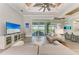 Open living space with large TV and access to outdoor patio at 16147 Lankford Ct, Port Charlotte, FL 33981