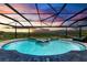Stunning saltwater pool and spa with covered lanai offering water views at 16147 Lankford Ct, Port Charlotte, FL 33981