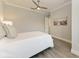 Light and airy bedroom with ceiling fan and wood flooring at 16147 Lankford Ct, Port Charlotte, FL 33981