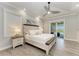 Spacious main bedroom with a large bed, ceiling fan, and access to backyard at 16147 Lankford Ct, Port Charlotte, FL 33981