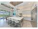 Gourmet kitchen with white cabinets, large island, and stainless steel appliances at 16147 Lankford Ct, Port Charlotte, FL 33981