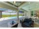 Spacious pool and patio area with luxurious seating and serene water views at 16147 Lankford Ct, Port Charlotte, FL 33981