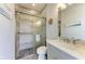 Modern bathroom with a walk-in shower, tiled walls and gray vanity at 16147 Lankford Ct, Port Charlotte, FL 33981
