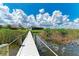 White dock leading to a canal-front house at 16147 Lankford Ct, Port Charlotte, FL 33981