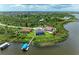 Aerial view of a waterfront home with a private dock and pool at 16147 Lankford Ct, Port Charlotte, FL 33981