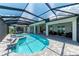 Expansive pool and lanai with outdoor kitchen and comfortable seating; tranquil views at 16147 Lankford Ct, Port Charlotte, FL 33981