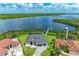 Aerial view of a waterfront home with a private dock at 16147 Lankford Ct, Port Charlotte, FL 33981