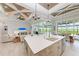 Open kitchen with large island, stainless steel appliances, and white cabinets at 16147 Lankford Ct, Port Charlotte, FL 33981
