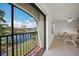 Spacious balcony with sliding doors offering a lake view at 23465 Harborview Rd # 1021, Punta Gorda, FL 33980
