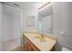 Corner bathroom vanity with wood cabinets and a sink at 23465 Harborview Rd # 1021, Punta Gorda, FL 33980