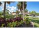 Exterior view of building with landscaping and parking at 23465 Harborview Rd # 1021, Punta Gorda, FL 33980