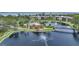 Aerial view of community with lake, tennis courts, and pool at 23465 Harborview Rd # 1021, Punta Gorda, FL 33980